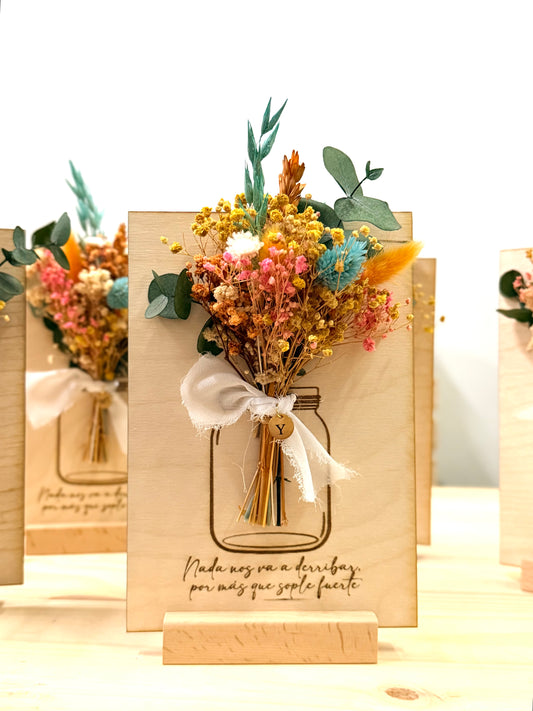 Placa con ramo de flor y medalla